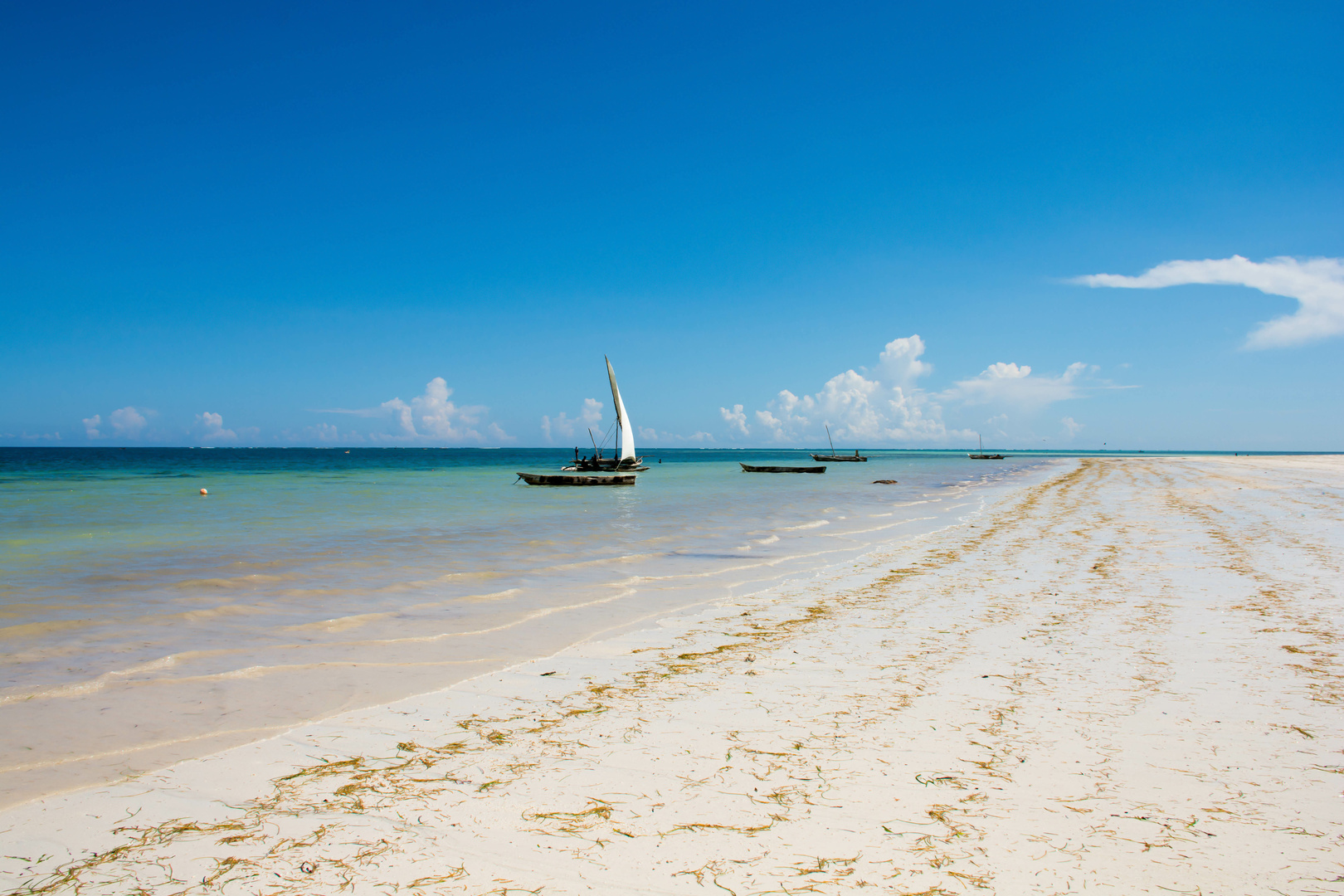 Check Wall mural Sunny Kenya, beach, boat, sun, sand, sailboat, shades of blue, blue sky Wall mural Sunny Kenya, beach, boat, sun, sand, sailboat, shades of blue, blue sky