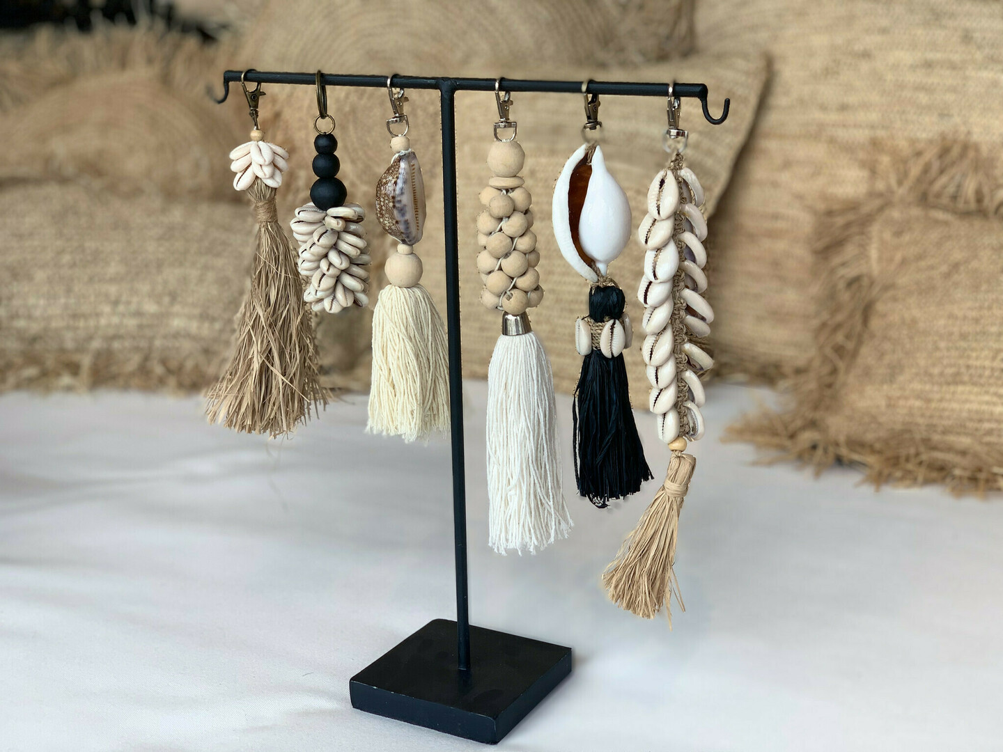 View The Raffia Cowrie Shell Keychain The Raffia Cowrie Shell Keychain