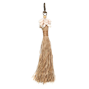 The Raffia Cowrie Shell Keychain 0 The Raffia Cowrie Shell Keychain small 0