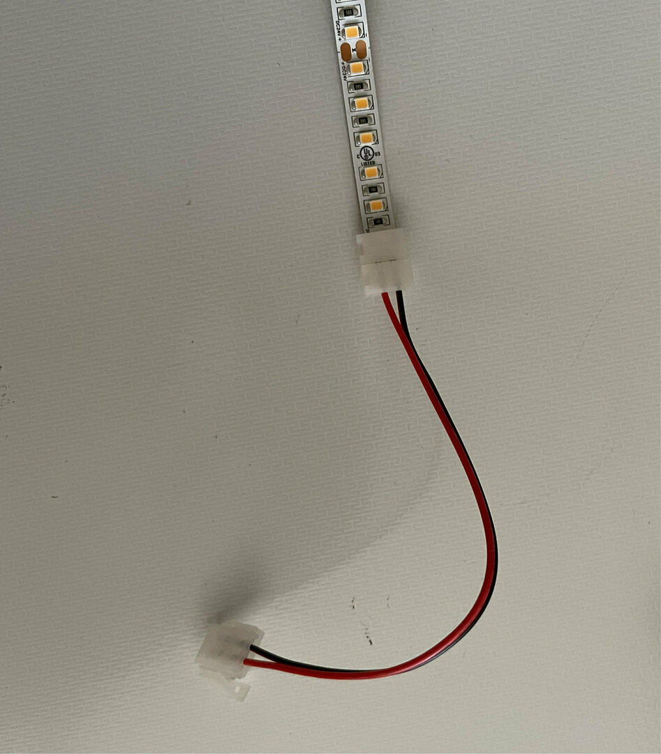 View LED tape connector 8mm 2 sided cable with 2 latches. LED tape connector 8mm 2 sided cable with 2 latches.