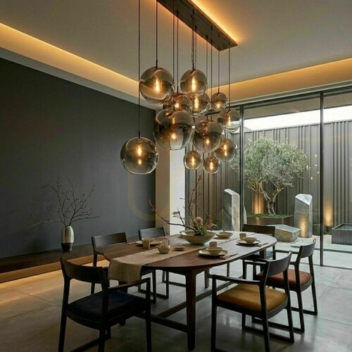 Check s.luce Orb 12-light gold glass chandelier, 2-row dining room pendant