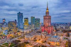 Wall mural Illuminated Warsaw Center in the Evening, Palace of Culture and Skyscrapers small 0